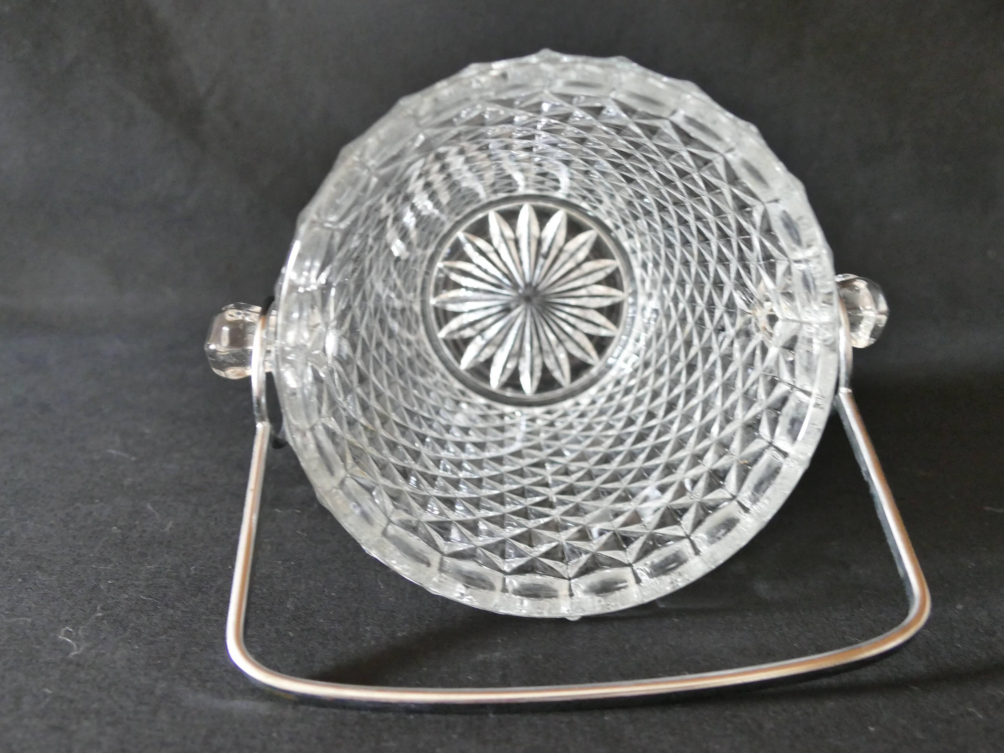 Vintage glass ice bucket stamped with a metal handle