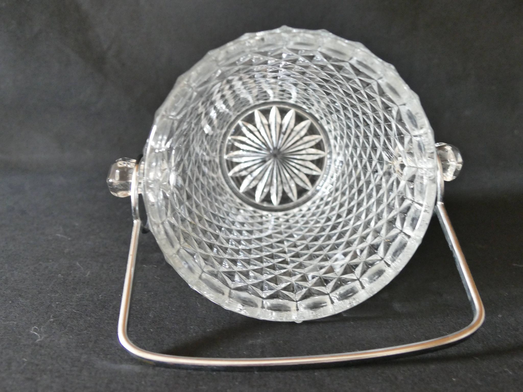 Vintage glass ice bucket stamped with a metal handle