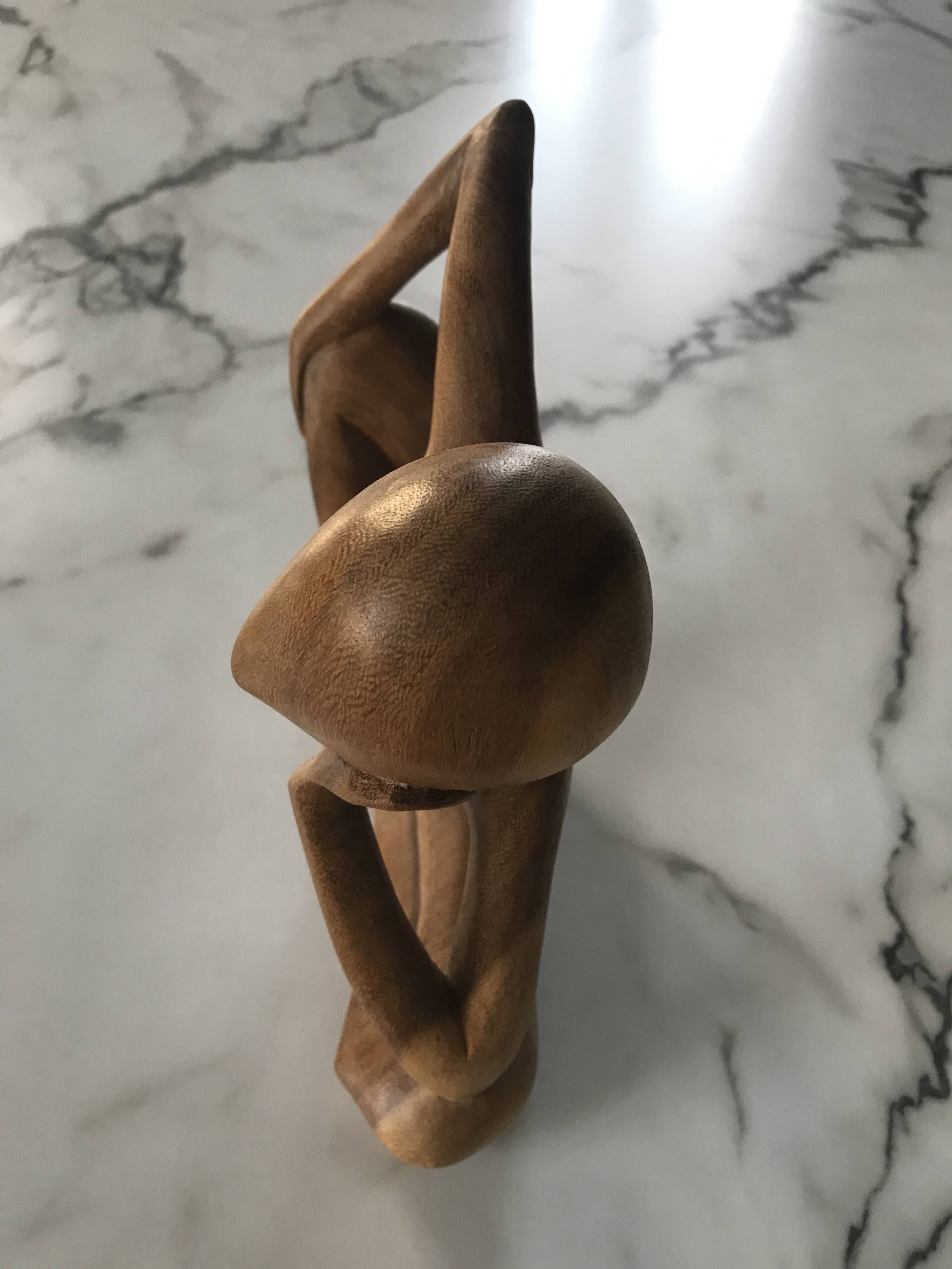 Pensive man wooden statue