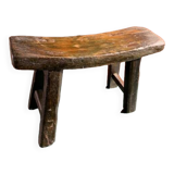 Antique milking stool in rustic curved wood, 19th century