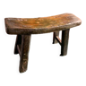 Antique milking stool in rustic curved wood, 19th century