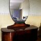Coiffeuse art deco avec miroir biseauté de forme ovale