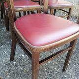 Set of 4 bistro chairs in curved wood and vintage red skai seats.