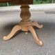 Round dining table with a central pedestal, extendable, stripped in solid walnut with 2 extensions.