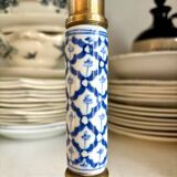 Candlestick in gilded brass and blue earthenware