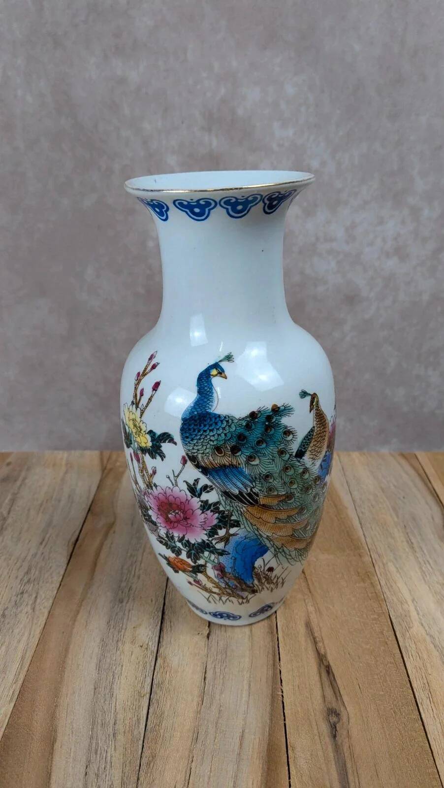 Asian vase decorated with peacock in porcelain