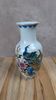 Asian vase decorated with peacock in porcelain