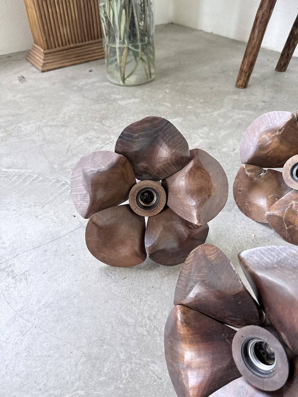Four wooden flower wall lights from the 1970s.