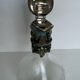 Glass decanter and silver metal frame
