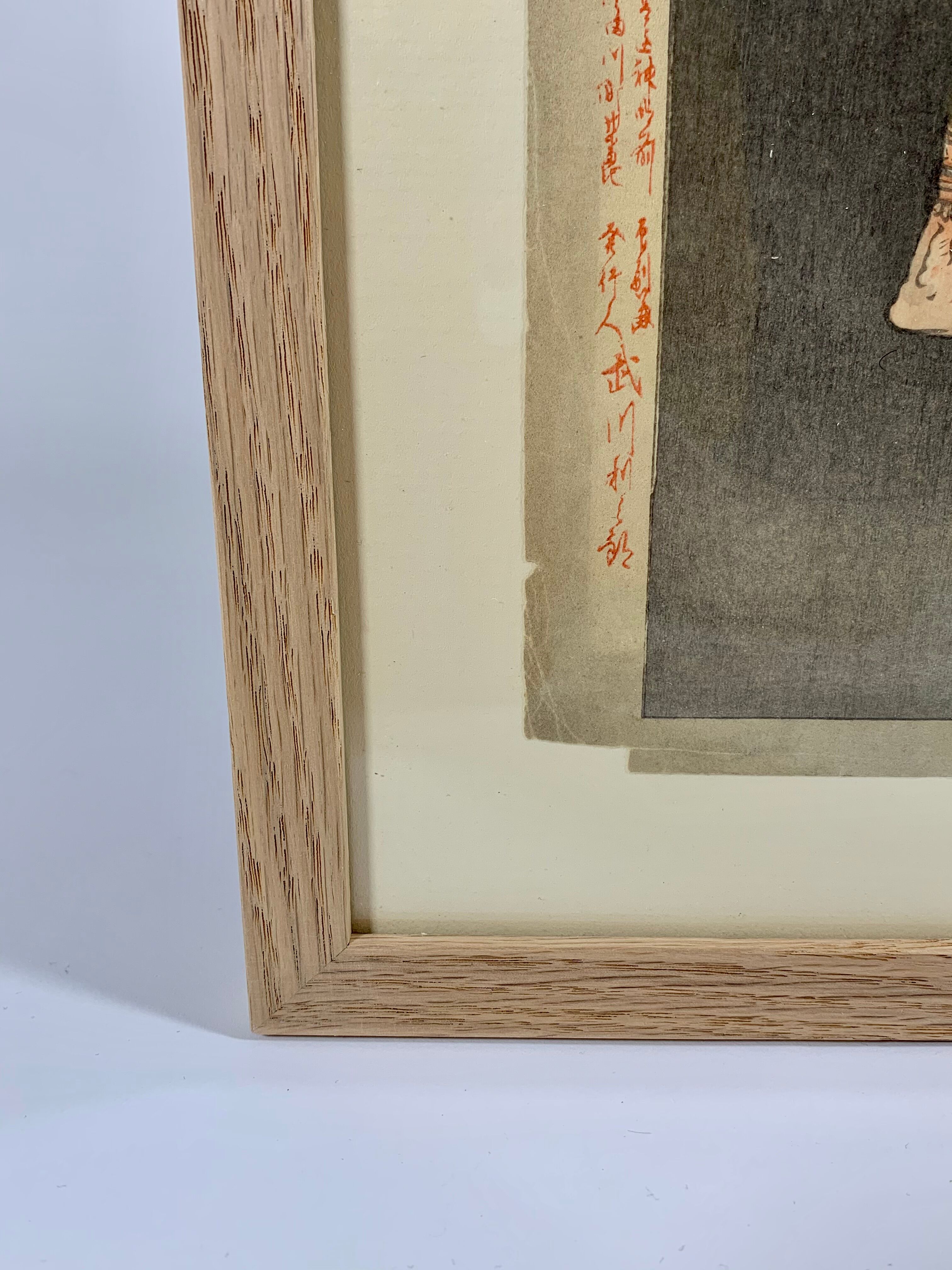 Estampe japonaise du XIXème siècle encadrée signée Ogata Gekko "Guerriers sur l'île d'Onigashima"