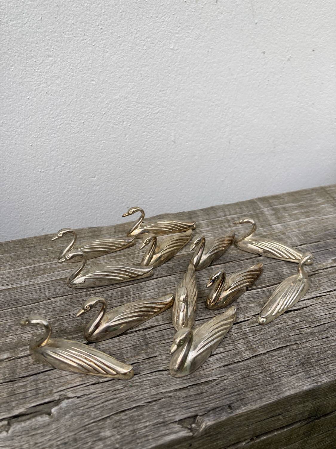 12 duck knife holders in silver metal