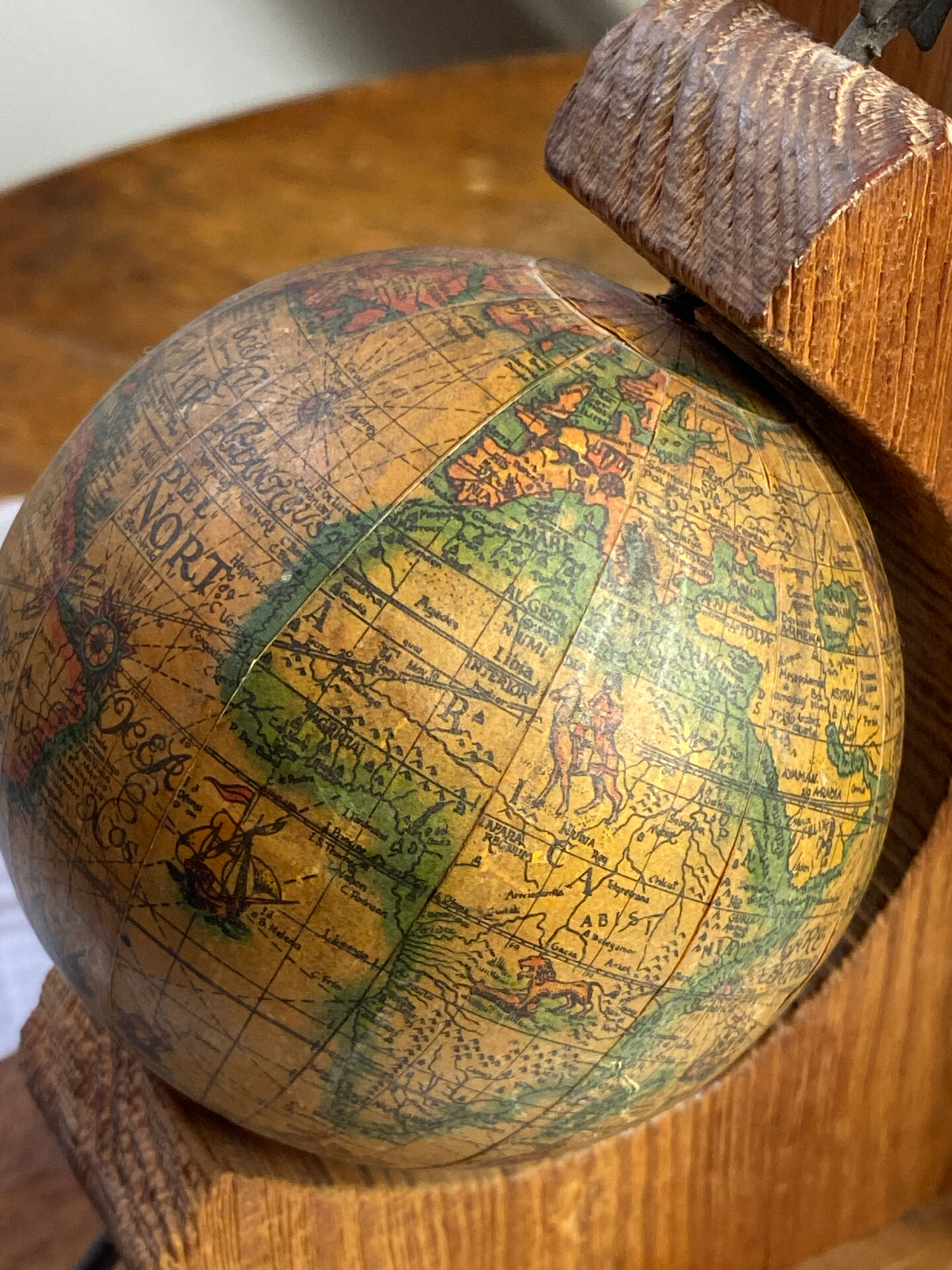 Pair of wooden bookends, rotating globes