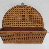 Old mail rack in wood and honey-colored rattan
