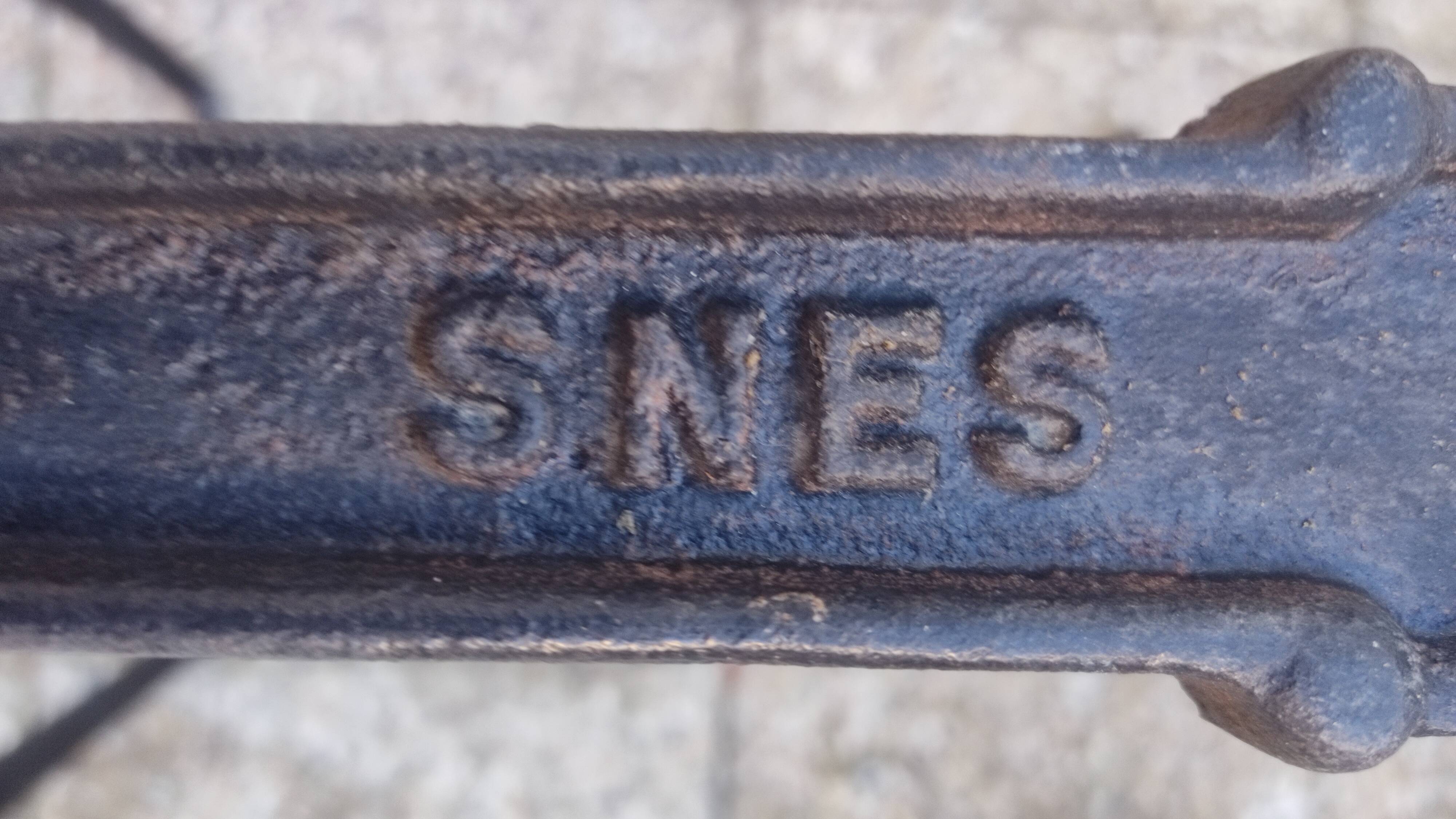 White marble table, cast iron base signed SNES, made in France