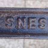 White marble table, cast iron base signed SNES, made in France