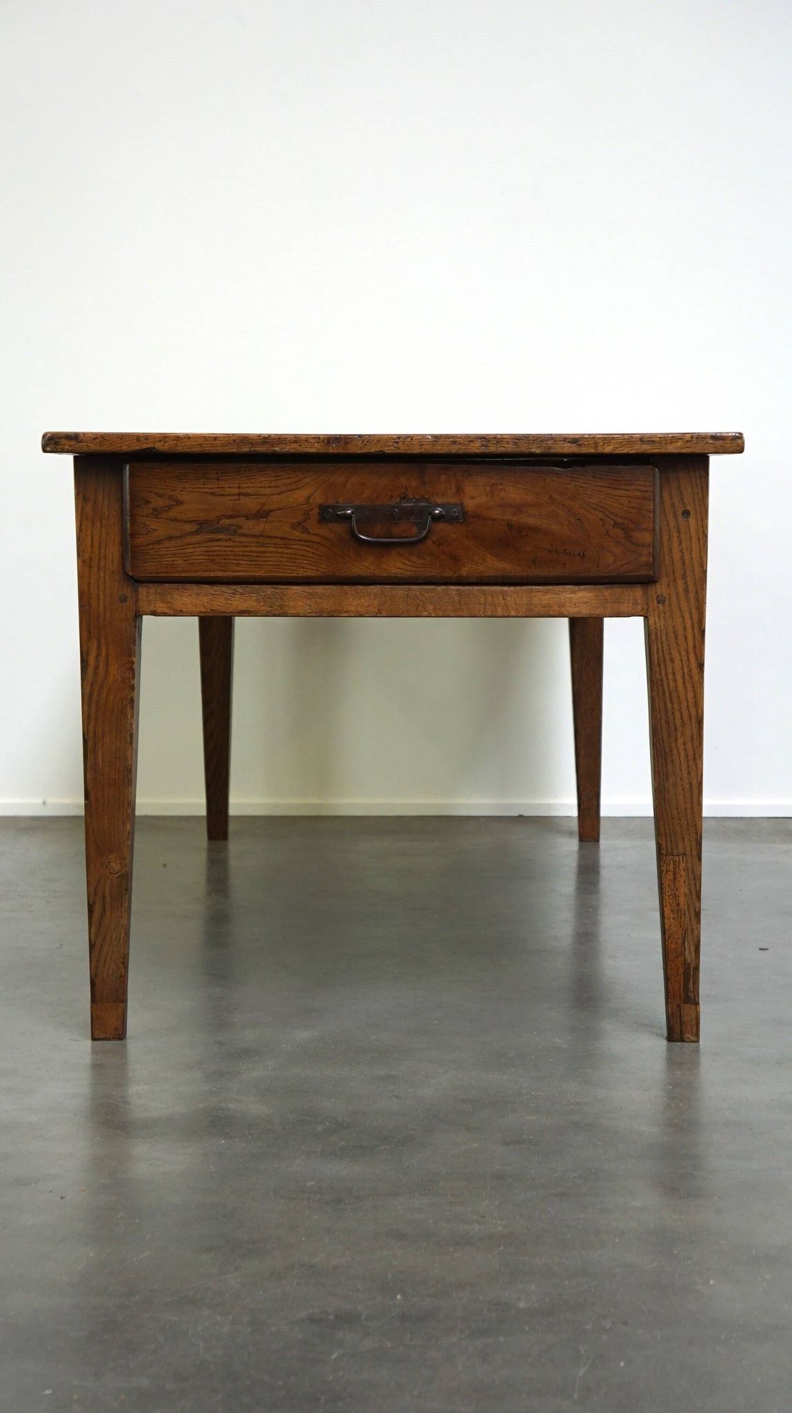 antique French oak dining table with 3 drawers and an exquisite patina