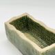 Rectangular ceramic vase signed, woven interior.