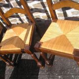Set of 6 oak dining chairs with high backs and straw seats