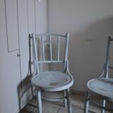 Pair of Lichtig bistro chairs in painted grey beech, pressed seat, circa 1900.