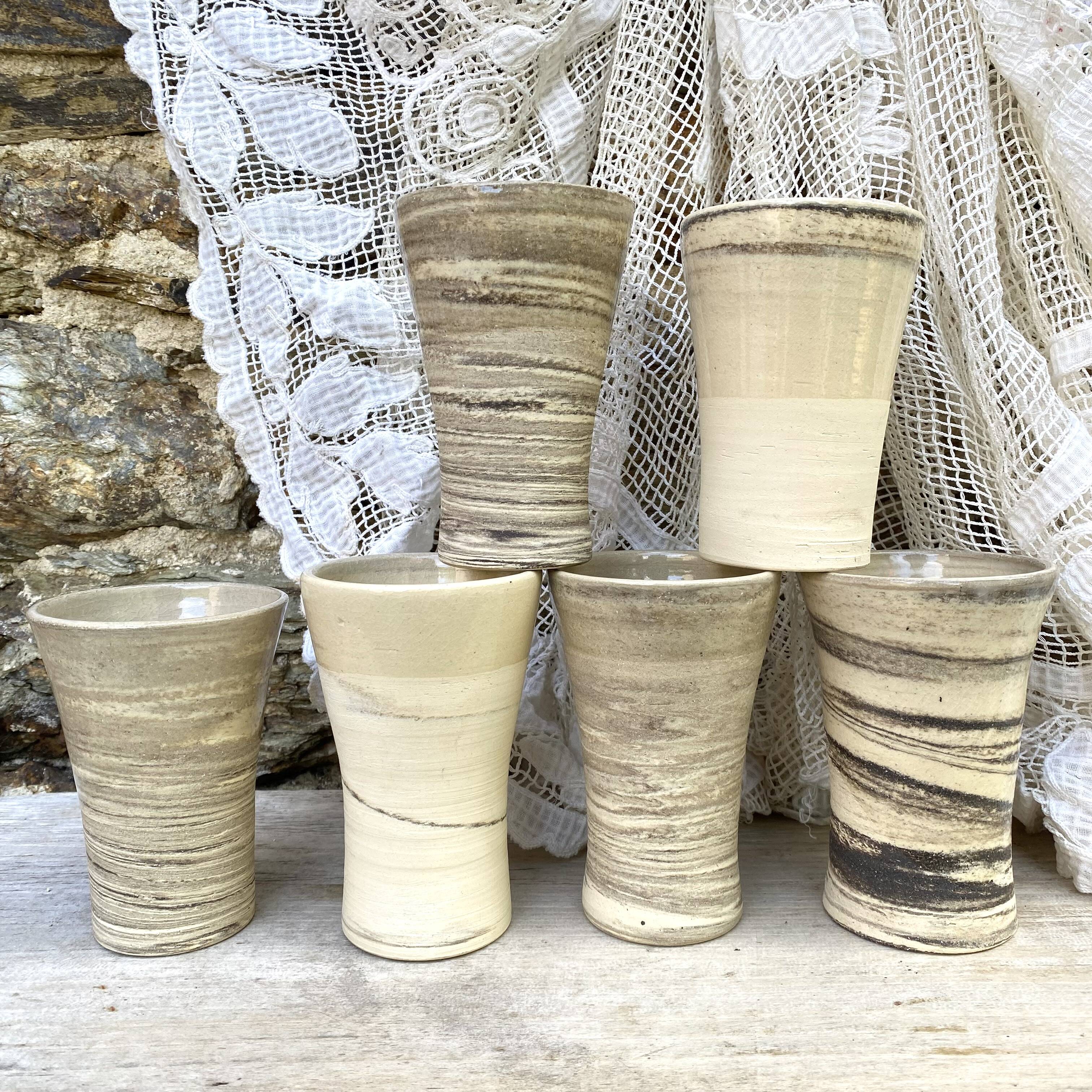 High ceramic cups made of mixed clay.