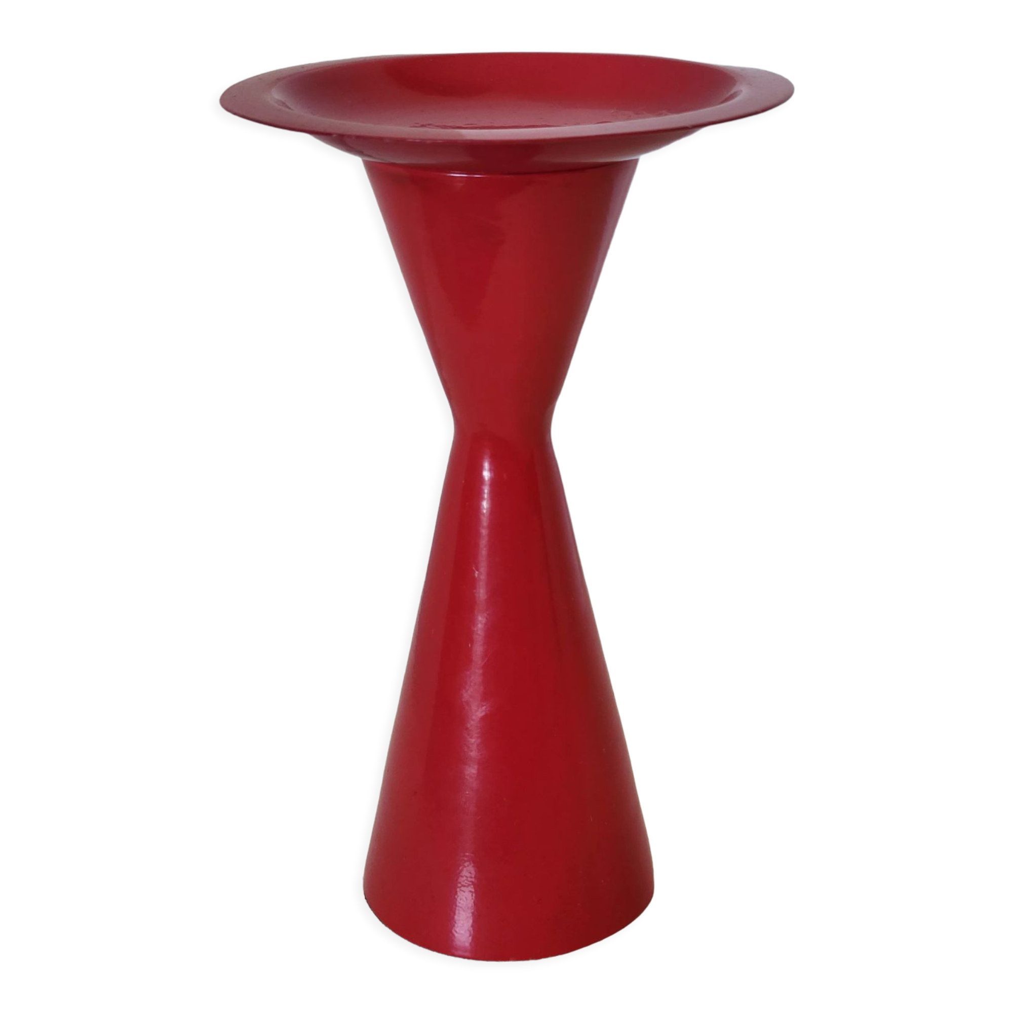 Vintage design candlestick in red metal in the shape of an hourglass