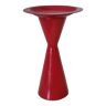 Vintage design candlestick in red metal in the shape of an hourglass