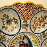 Dish, egg server in hand-painted earthenware, signed Geo Martel