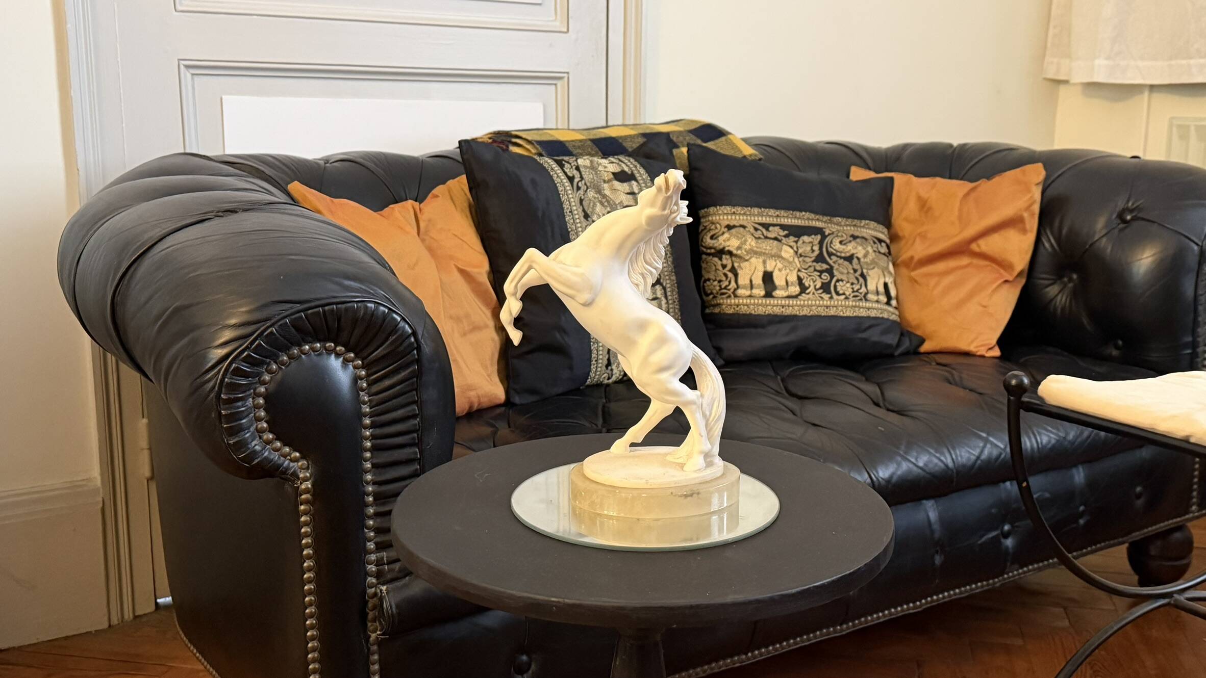 White rearing horse statuette