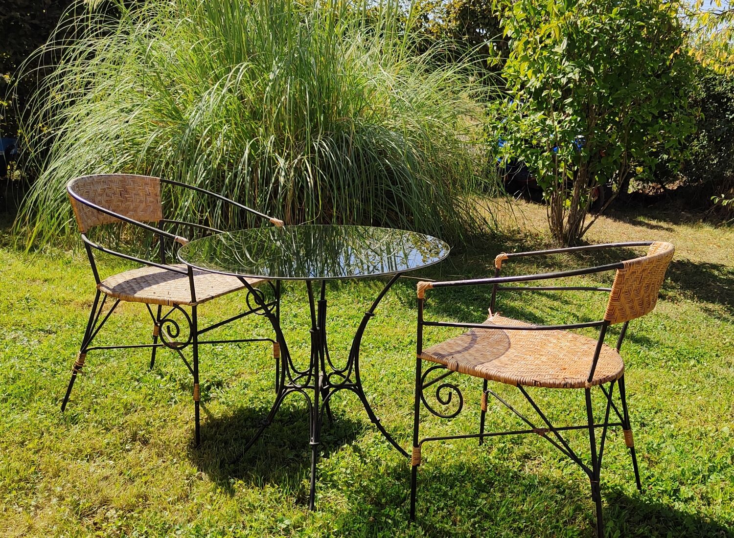 Garden table and wrought iron chair