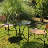 Garden table and wrought iron chair