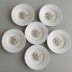 7 assiettes creuses CBM, décor champêtre floral et papillon, 1988
