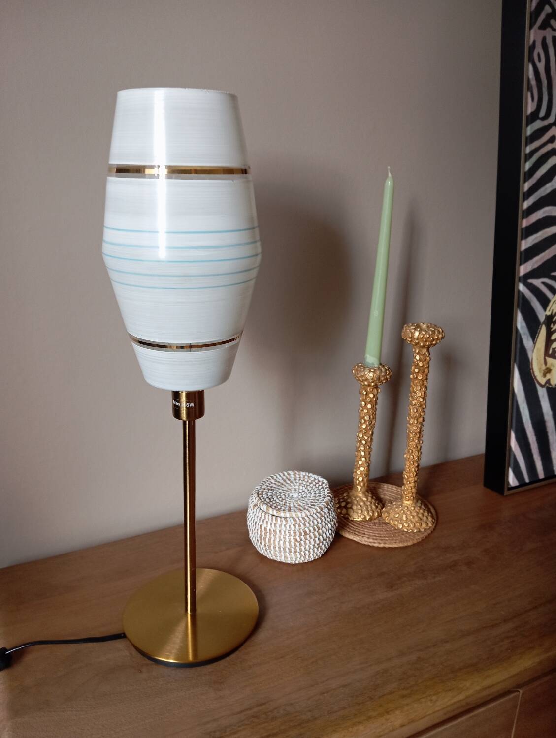 Mid-century gold metal table lamp with white striped shade