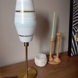 Mid-century gold metal table lamp with white striped shade