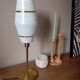 Mid-century gold metal table lamp with white striped shade