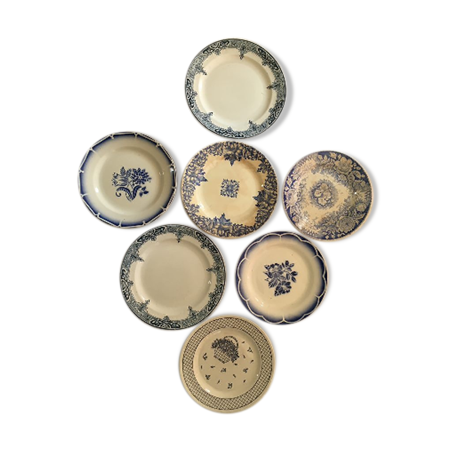 Together seven dessert plates mismatched in blue.