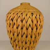 Rattan vase and braided bamboo leaves