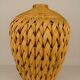 Rattan vase and braided bamboo leaves