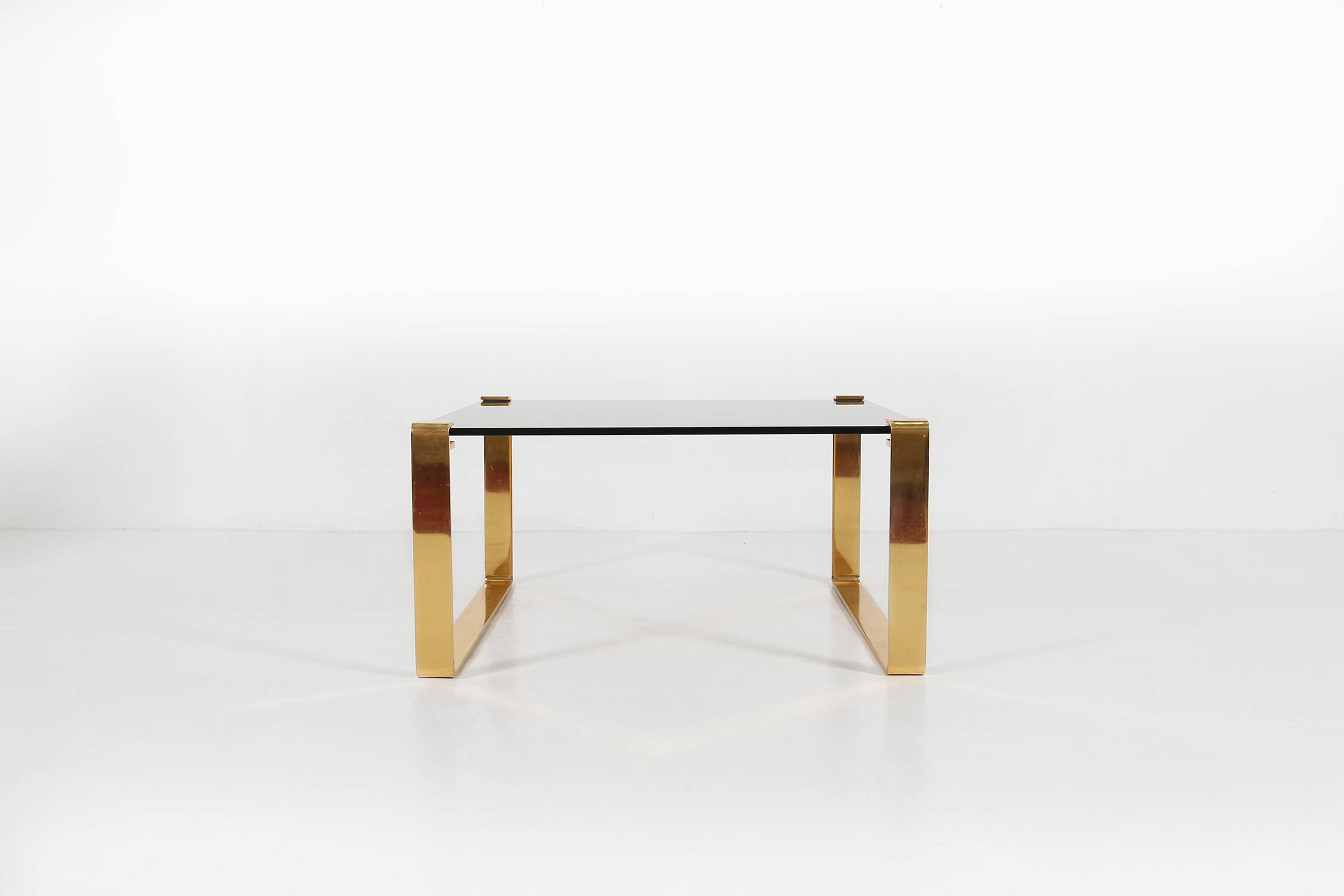 Mid-century coffee table with gold plated base and glass top, 1970s