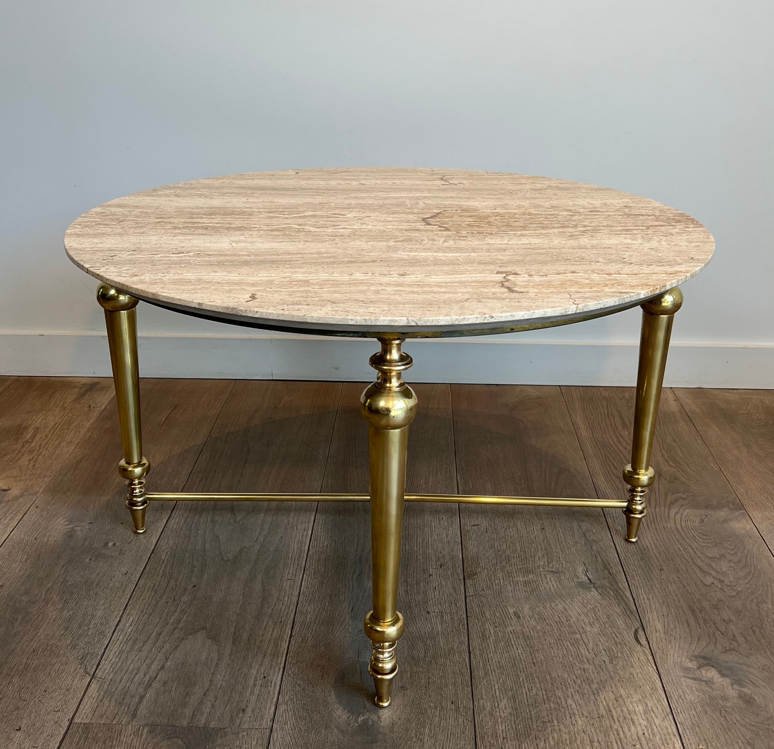 Brass coffee table with a white marble top.