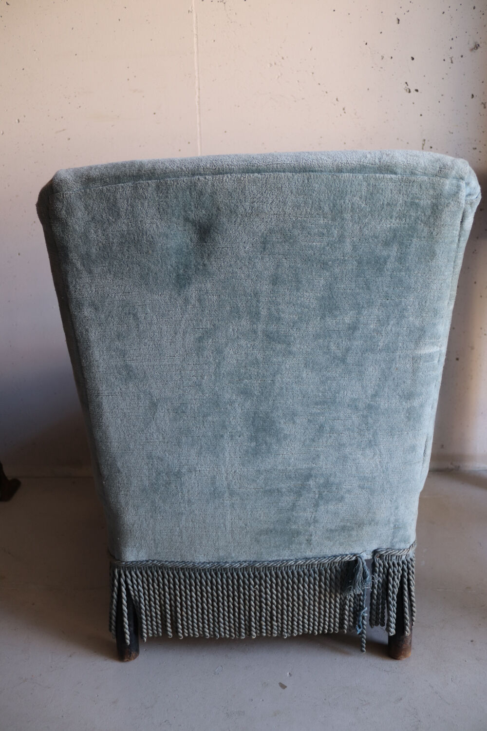 Vintage blue velvet fringed armchair.