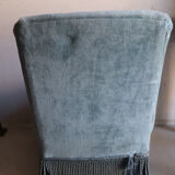 Vintage blue velvet fringed armchair.