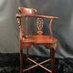 Corner armchair in solid wood with carved floral decoration featuring a bird.