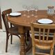 Oak dining table, oval living room table with two extensions.