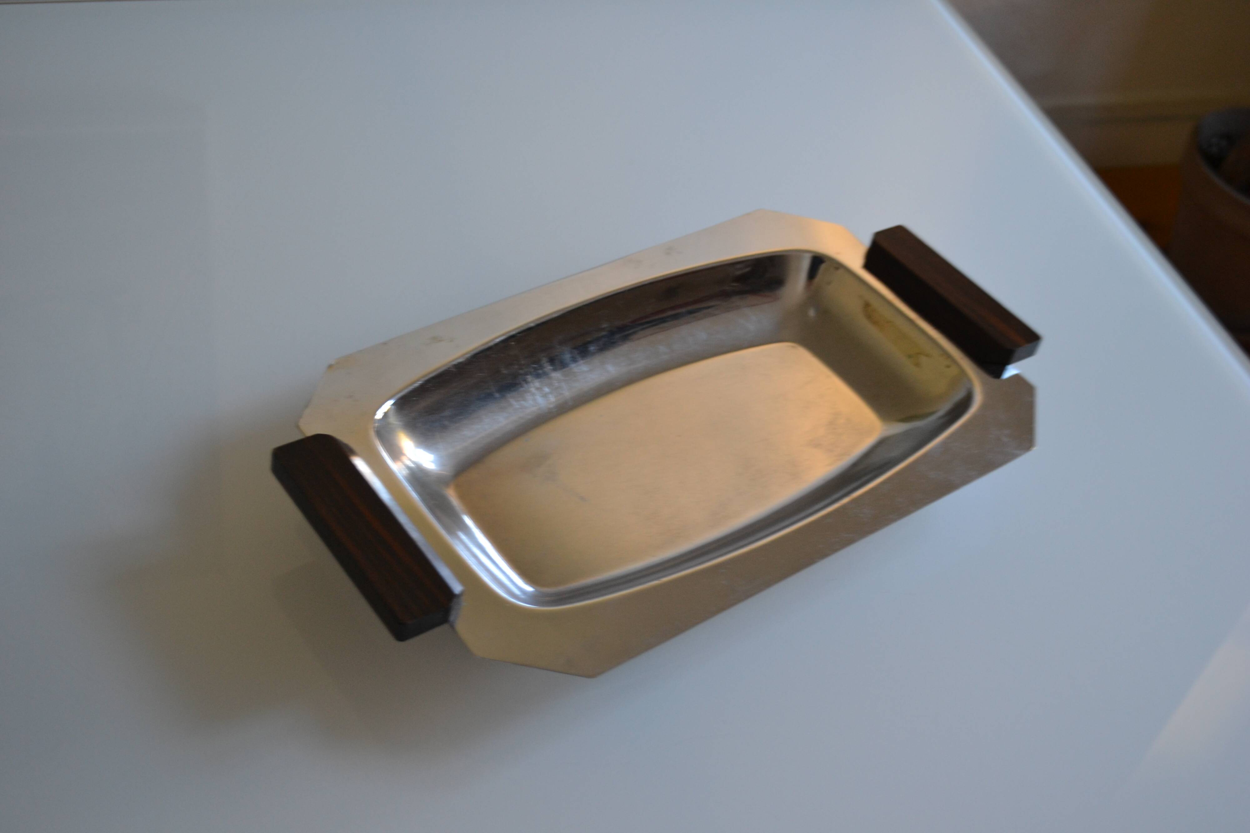 Art Deco serving dish in chrome metal with ebony handles.