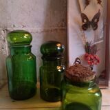 Trio of green glass apothecary bottles