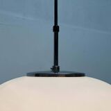 Minimalist suspended glass ball lamp from the vintage German space age by Glashütte Limburg, 1970s.