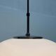Minimalist suspended glass ball lamp from the vintage German space age by Glashütte Limburg, 1970s.
