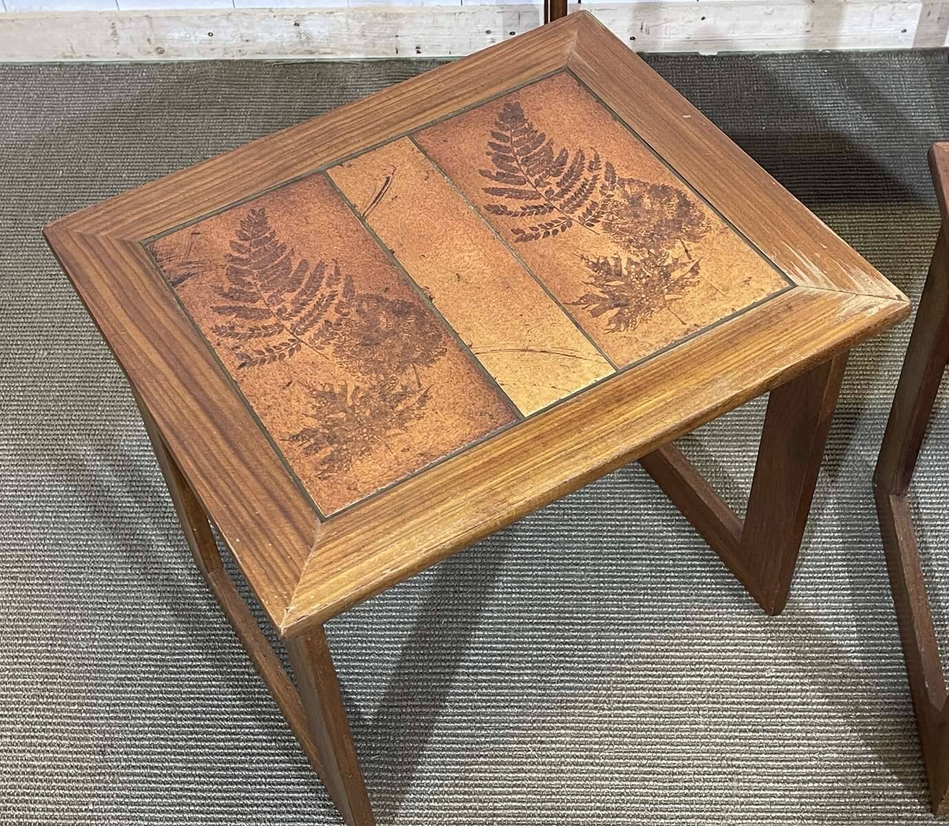 Set of 3 nesting tables in teak with tiled tops.