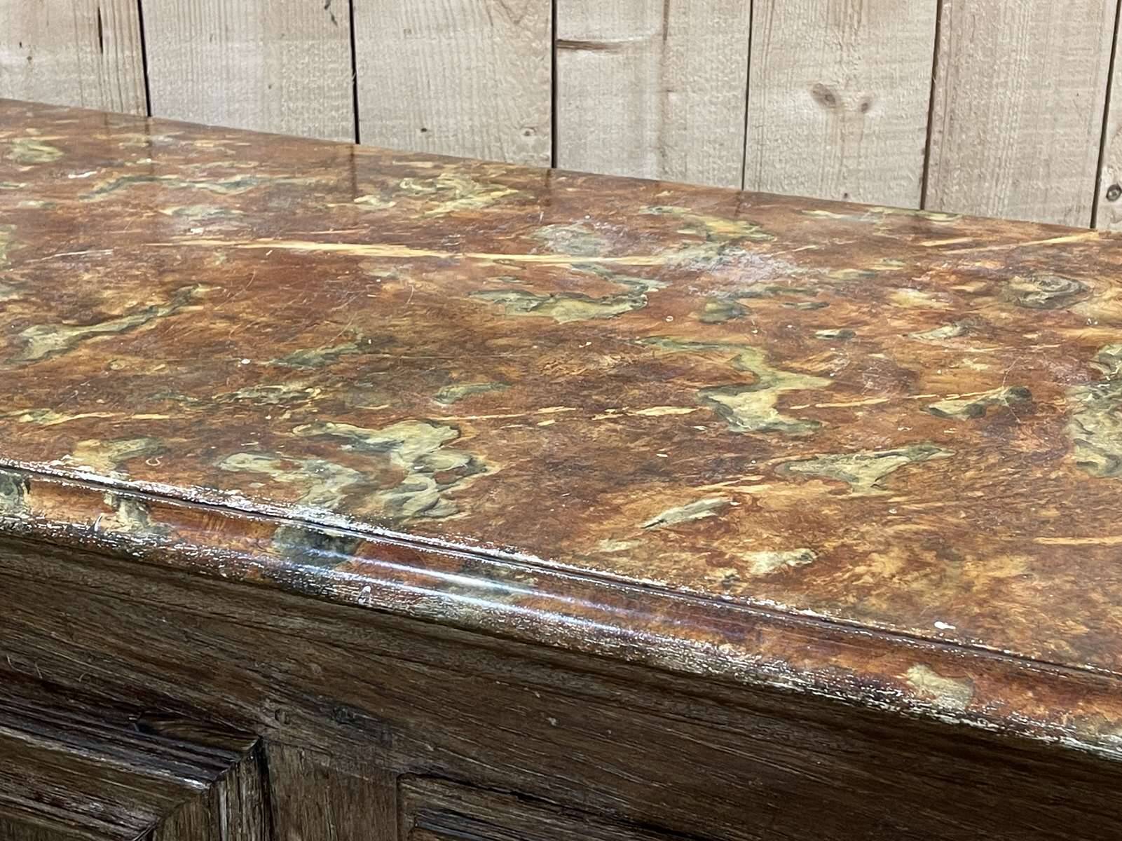 18th-century oak enfilade with a marble-effect painted top.