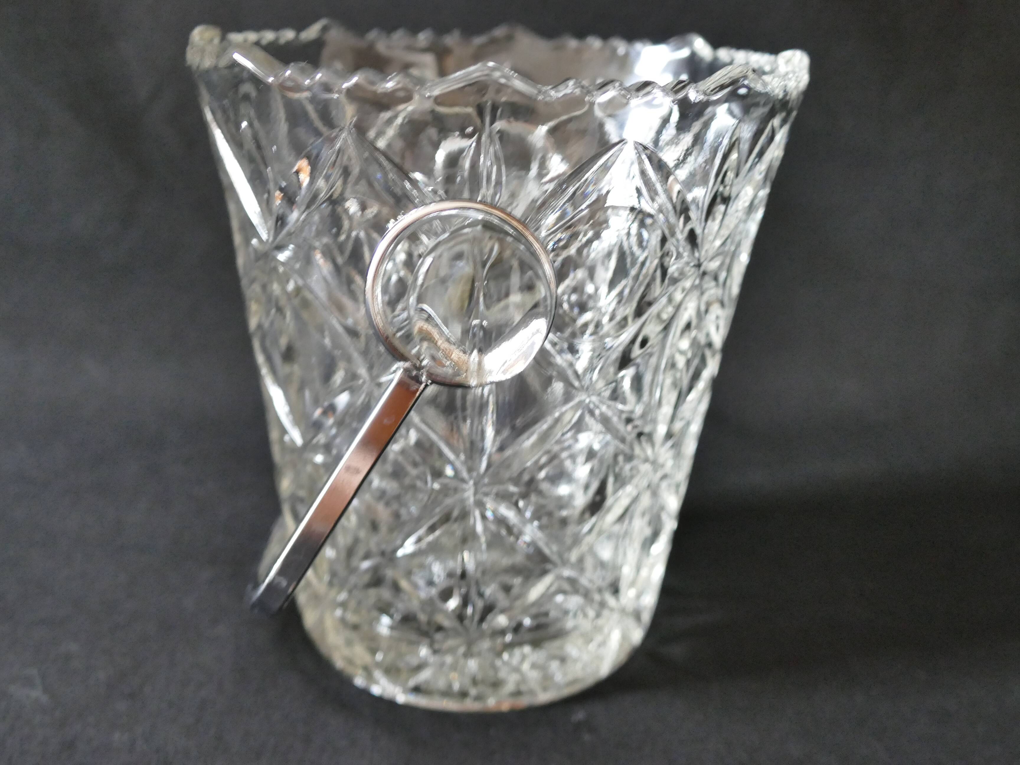 Vintage glass ice bucket stamped with a metal handle